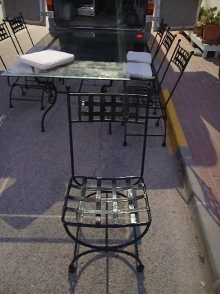 Mesa cristal y 6 sillas metal