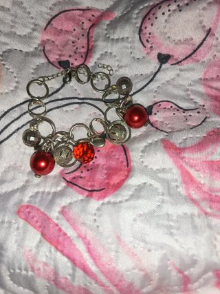 Braccialetto rosso e acciaio elegante