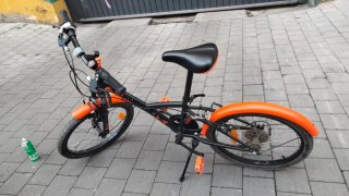 Bicicleta infantil BTWIN naranja 20 pulgadas.