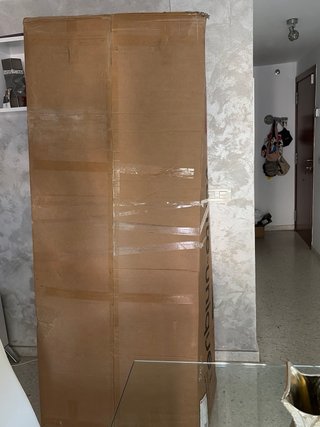 Sofá gris de tela sin estrenar