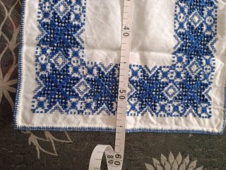 Tapete bordado a mano con servilletas