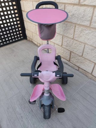 Triciclo infantil rosa y gris