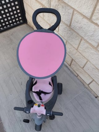 Triciclo infantil rosa y gris