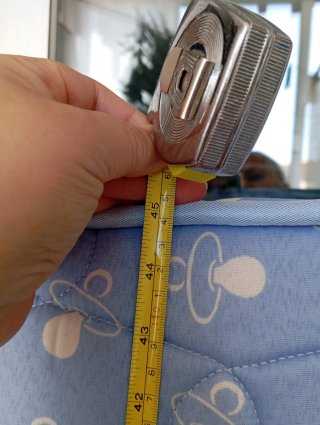 Colchón cuna azul con dibujos