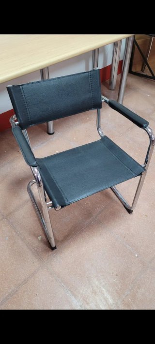 4 Sillónes de cuero y acero inoxidable