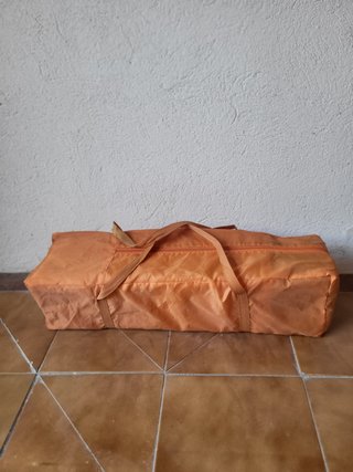 Cuna de viaje naranja