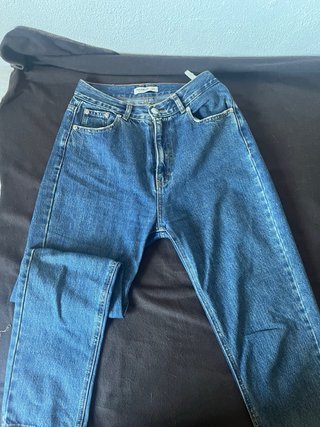 Falda vaquera larga azul y dos pantalones vaqueros