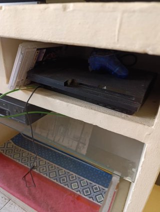 PlayStation 3 con juegos y mando