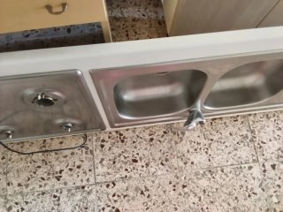 Cucina angolare legno e acciaio