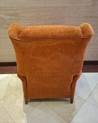 Sofá individual reclinable naranja de tela