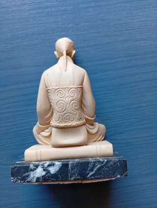Figura cerámica músico con flauta
