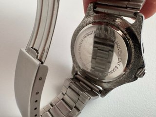 Reloj de pulsera acero inoxidable y esfera negra