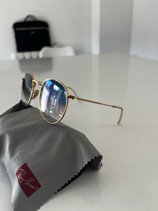 Gafas de sol Ray-Ban redondas doradas