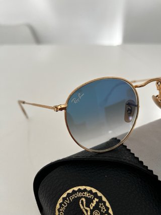Gafas de sol Ray-Ban redondas doradas