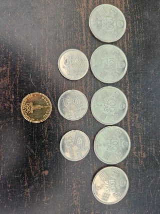 Monedas Mundiales: 100 y 25 PTAS