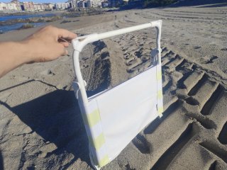 Silla baja de playa a rayas
