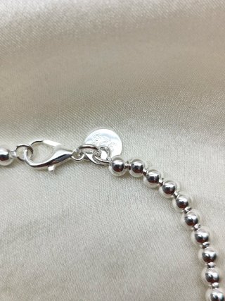 Pulsera bolitas plata con dije atrapasueños