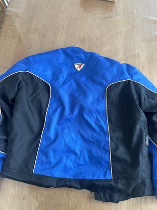 Chaqueta de moto azul y negra revolution R