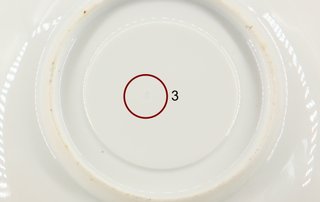 Taza de té antigua con platillo