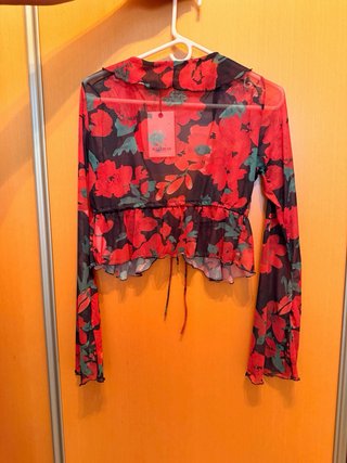 Blusa transparente floral manga larga
