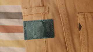 Pantalón corto vaquero beige desgastado