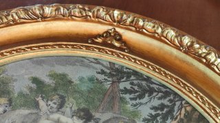 Quadro ovale putti dorato