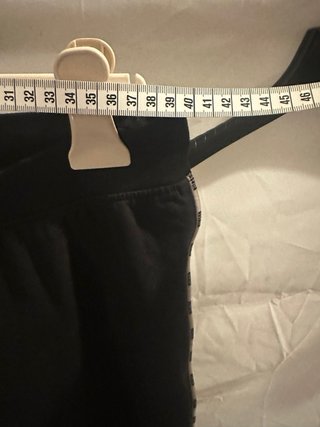 Pantaloni tuta neri con banda laterale