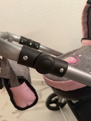 Carrito de muñecas gris y rosa