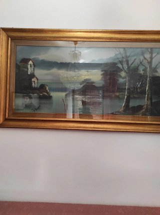 Quadro con cornice dorata