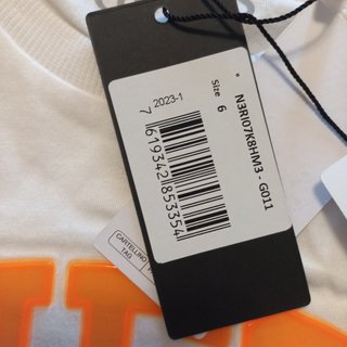 T-shirt GUESS bianca con stampa arancione
