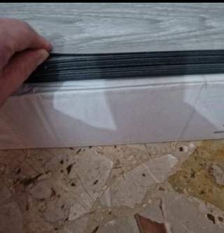 Rivestimento pavimento effetto legno grigio