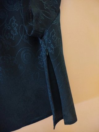 Traje elegante verde azulado
