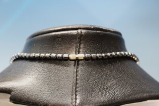 Collar de hematita y  ojo de tigre con elefante.