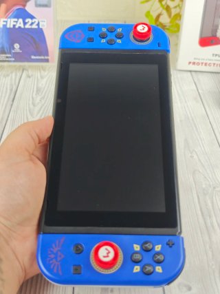 Consola Nintendo switch+ juego+ cargador+accesorio
