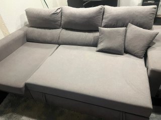 Sofá cama gris con arcón