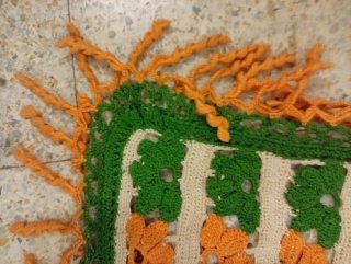 Manta tejida a mano naranja y verde