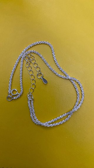 Tobillera de bisutería plateada