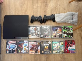 PS3 Slim Negra + 2 Mandos + 10 Juegos