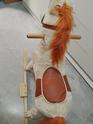 Caballo balancín peluche con melodias