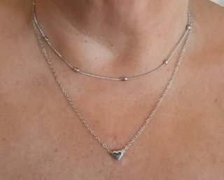 Doble gargantilla con corazón plateada.Nueva