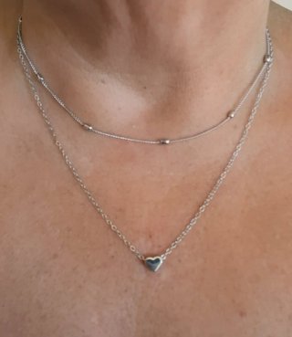Doble gargantilla con corazón plateada.Nueva