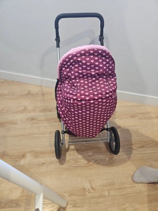 Carrito de muñecas rosa y morado