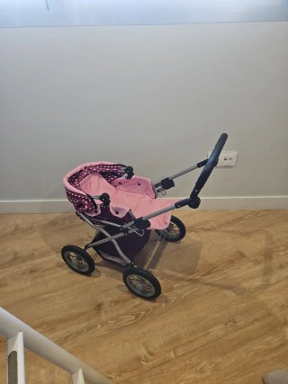 Carrito de muñecas rosa y morado