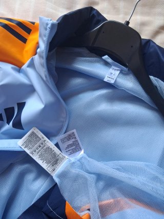 Chaqueta Real Madrid con capota Adidas Azul Naranj