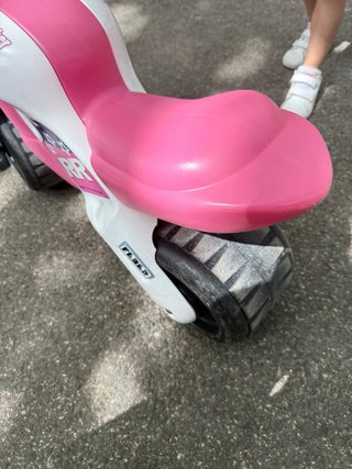 Moto de juguete infantil rosa y blanca