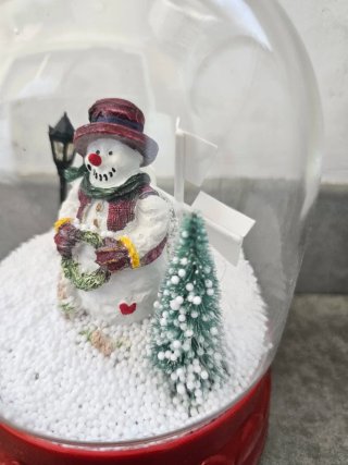 Bola de nieve Navidad con luz y música