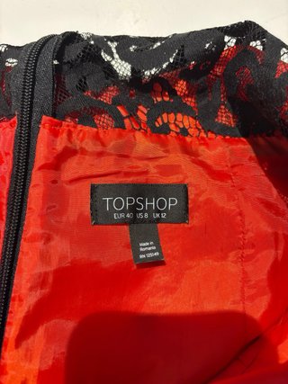 Mono Top Shop T40 color naranja tirando a rojo