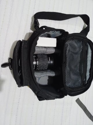 Mochila, objetivo y parasol Canon