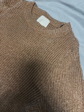 Blusa dorada brillante de punto
