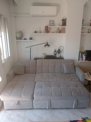 Sofá cama con arcón gris